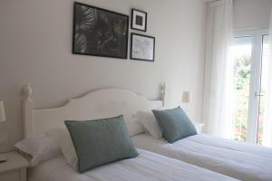 Postel nebo postele na pokoji v ubytování Lavaderos Suites