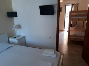 Postel nebo postele na pokoji v ubytování Almirikia Apartments