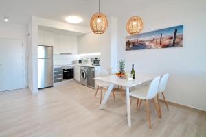 A kitchen or kitchenette at Alex Sun