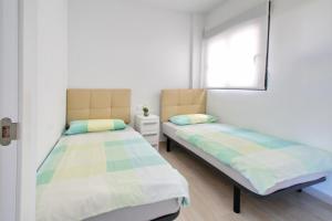 A bed or beds in a room at Alex Sun