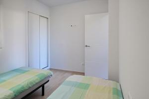 A bed or beds in a room at Alex Sun