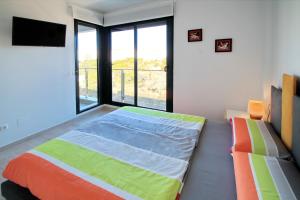 A bed or beds in a room at Alex Sun
