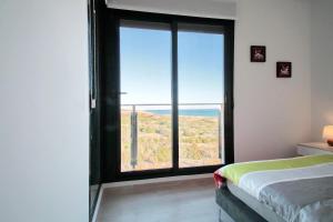 A bed or beds in a room at Alex Sun