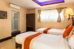 Katil atau katil-katil dalam bilik di Hotel Beijing Lu