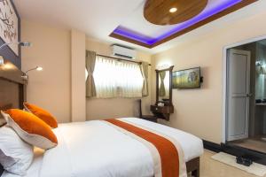 Katil atau katil-katil dalam bilik di Hotel Beijing Lu