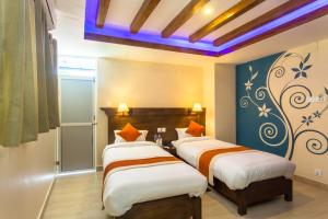 Katil atau katil-katil dalam bilik di Hotel Beijing Lu