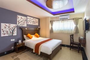Llit o llits en una habitació de Hotel Beijing Lu