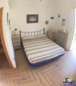 Postel nebo postele na pokoji v ubytování Magi - Camera Talia