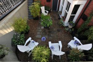 an aerial view of a patio with white chairs and flowers at The Gallery in Blackpool