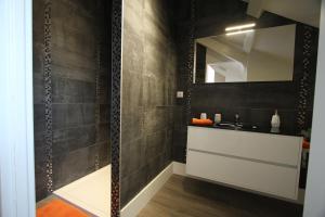 a bathroom with a sink and a mirror at Le clos des etoiles in Paray-le-Monial