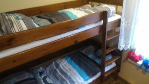 two sets of bunk beds in a room at Hołcyna in Brenna