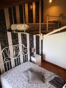 Postel nebo postele na pokoji v ubytování B&B Il Martin Pescatore