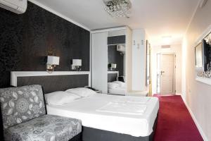 Postel nebo postele na pokoji v ubytování Vile Oliva Hotel & Resort