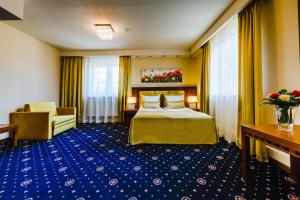 Łóżko lub łóżka w pokoju w obiekcie Grein Hotel