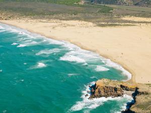 an aerial view of a beach and the ocean at Hotel Vale Da Telha in Aljezur
