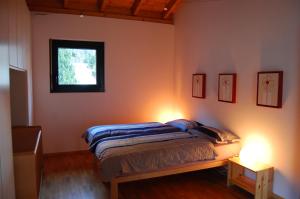 Postelja oz. postelje v sobi nastanitve B&B Il Vigneto