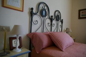 Ліжко або ліжка в номері Le Gemme di Pigna