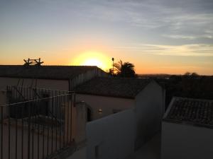 The sunrise or sunset as seen from a panziókat or nearby
