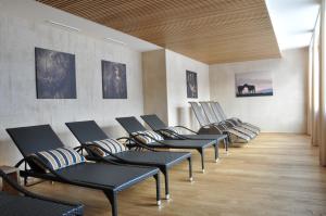 a row of chairs lined up in a waiting room at Appartements Tschol Martin in Sankt Anton am Arlberg