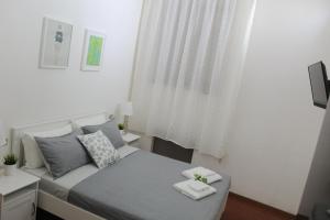 Televízia a/alebo spoločenská miestnosť v ubytovaní Santa Croce Exclusive