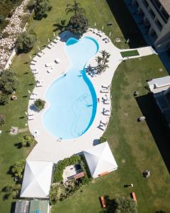 an overhead view of a swimming pool in a resort at Hotel San Teodoro in San Teodoro