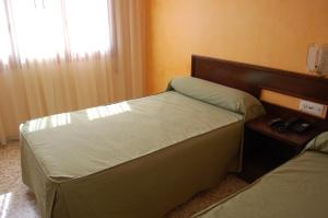 Postel nebo postele na pokoji v ubytování Hotel Balfagón