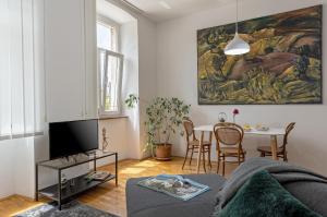 a living room with a couch and a table at MARKAAT Apartment in Pula