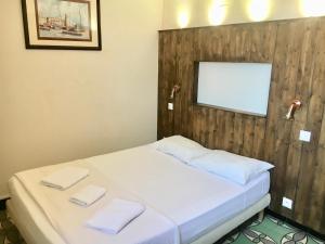 Postel nebo postele na pokoji v ubytování Hotel Le Centre