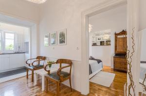 a bedroom with a bed and a table and chairs at MARKAAT Apartment in Pula