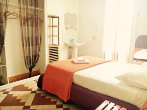 Postel nebo postele na pokoji v ubytování Hotel Le Centre