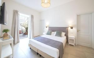 Postel nebo postele na pokoji v ubytování B&B Marina Garden