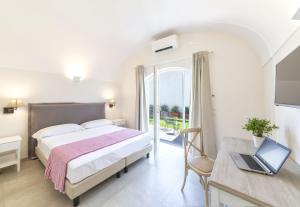 Postel nebo postele na pokoji v ubytování B&B Marina Garden