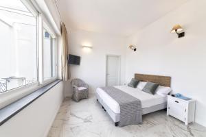 Postel nebo postele na pokoji v ubytování B&B Marina Garden