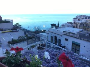 a view of the ocean from a building at Hotel Villa Delle Palme in Positano in Positano