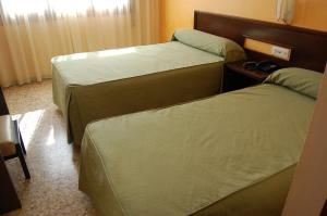 Postel nebo postele na pokoji v ubytování Hotel Balfagón