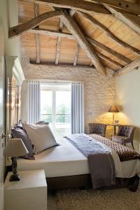Ένα ή περισσότερα κρεβάτια σε δωμάτιο στο Domaine de L'Isle Basse