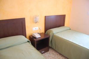 Postel nebo postele na pokoji v ubytování Hotel Balfagón