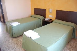 Postel nebo postele na pokoji v ubytování Hotel Balfagón