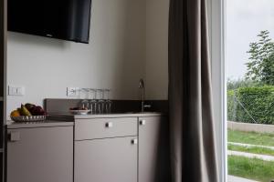Kuchyň nebo kuchyňský kout v ubytování Garda Guest House