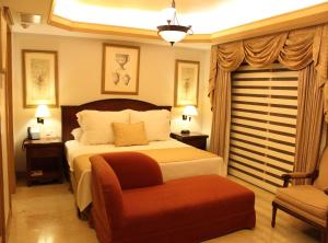 Giường trong phòng chung tại Hotel Hacienda Real