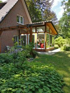 a screened in porch of a house at Ferienhaus Wahlers in Bispingen