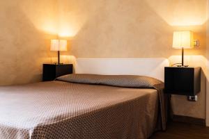 Posteľ alebo postele v izbe v ubytovaní Lazise Boutique Apartment Lago e Relax