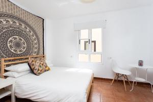 Postel nebo postele na pokoji v ubytování Duplex La Tosca by Sunkeyrents + 30 fotografií