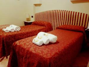 Postel nebo postele na pokoji v ubytování Hotel Sicilia