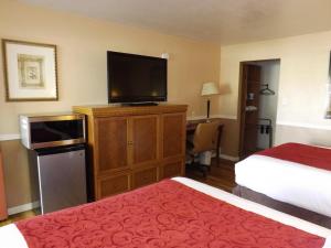 Ένα ή περισσότερα κρεβάτια σε δωμάτιο στο Sage Motel