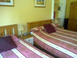 מיטה או מיטות בחדר ב-Mackenzie Guest house