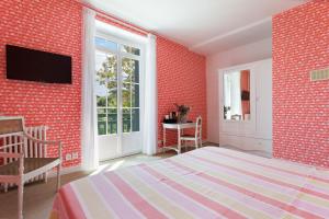 Ein Bett oder Betten in einem Zimmer der Unterkunft Hotel Les Goelands