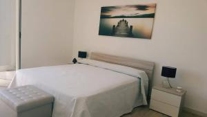 Krevet ili kreveti u jedinici u okviru objekta Hotel Falco D'oro