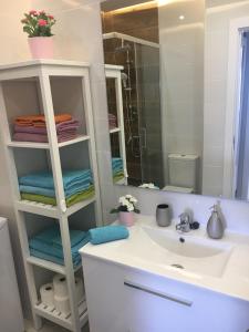 a bathroom with a sink and a mirror at Amazing View in Los Cristianos in Los Cristianos