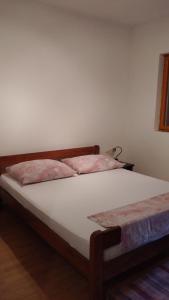 Postel nebo postele na pokoji v ubytování Apartman Joso